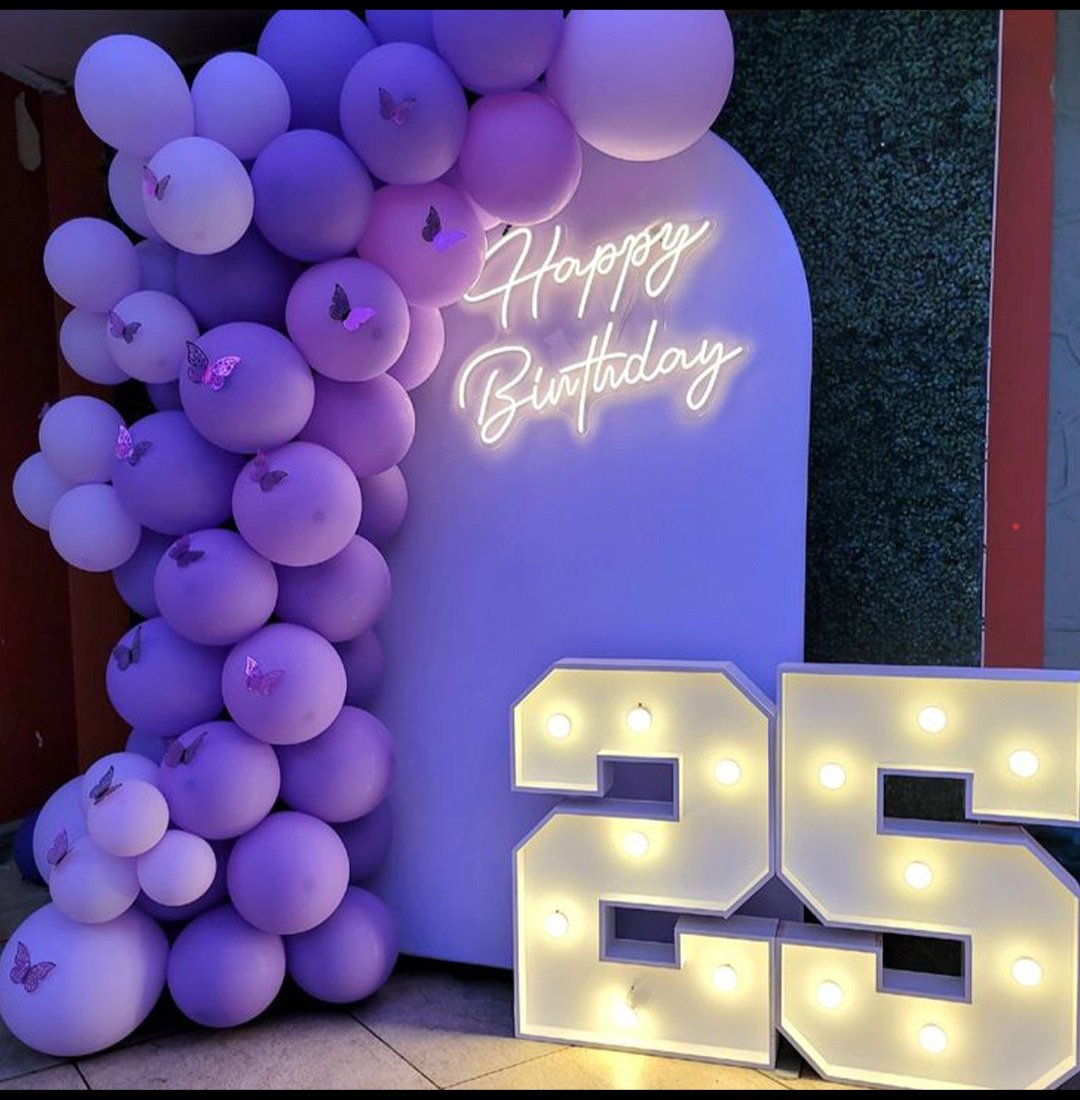 Purple balloon garland birthday decoration with neon sign
