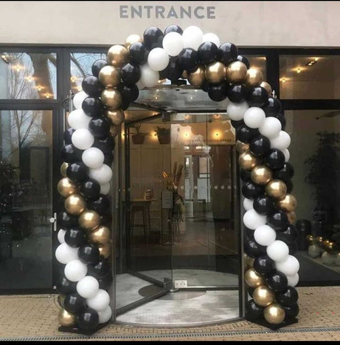 Black gold and white balloon entrance arch for a shop opening