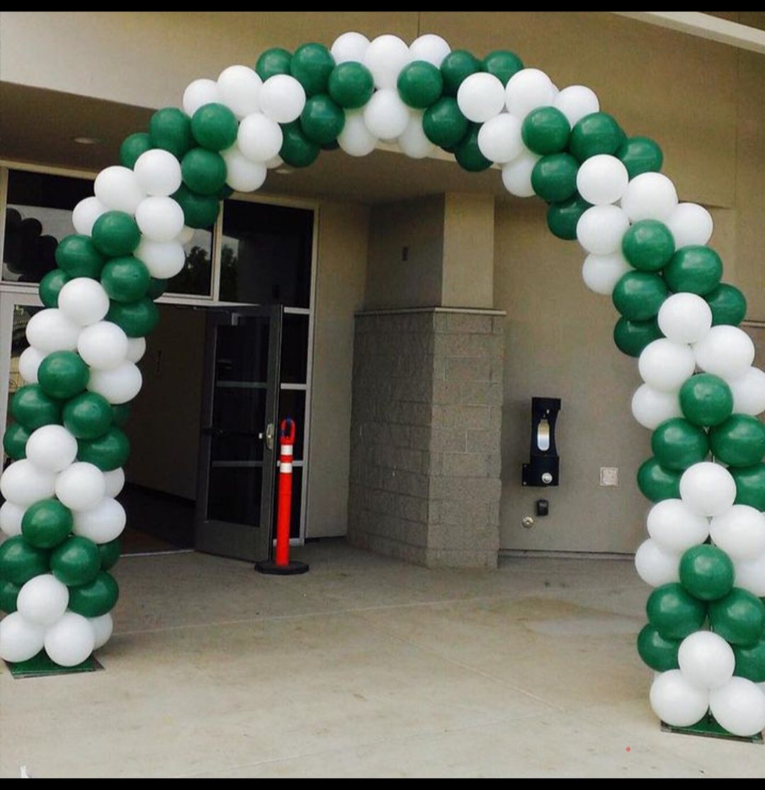Green and white balloon entrance arch for a shop